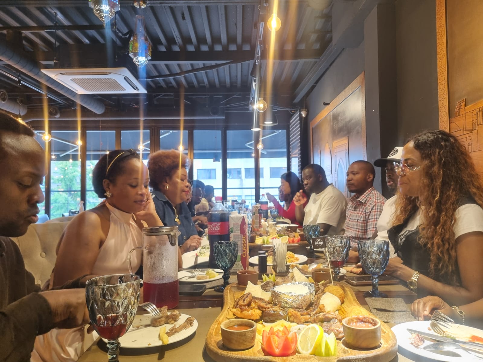 Members sharing a meal along both sides of the table at the 16 August 2026 USKA dinner