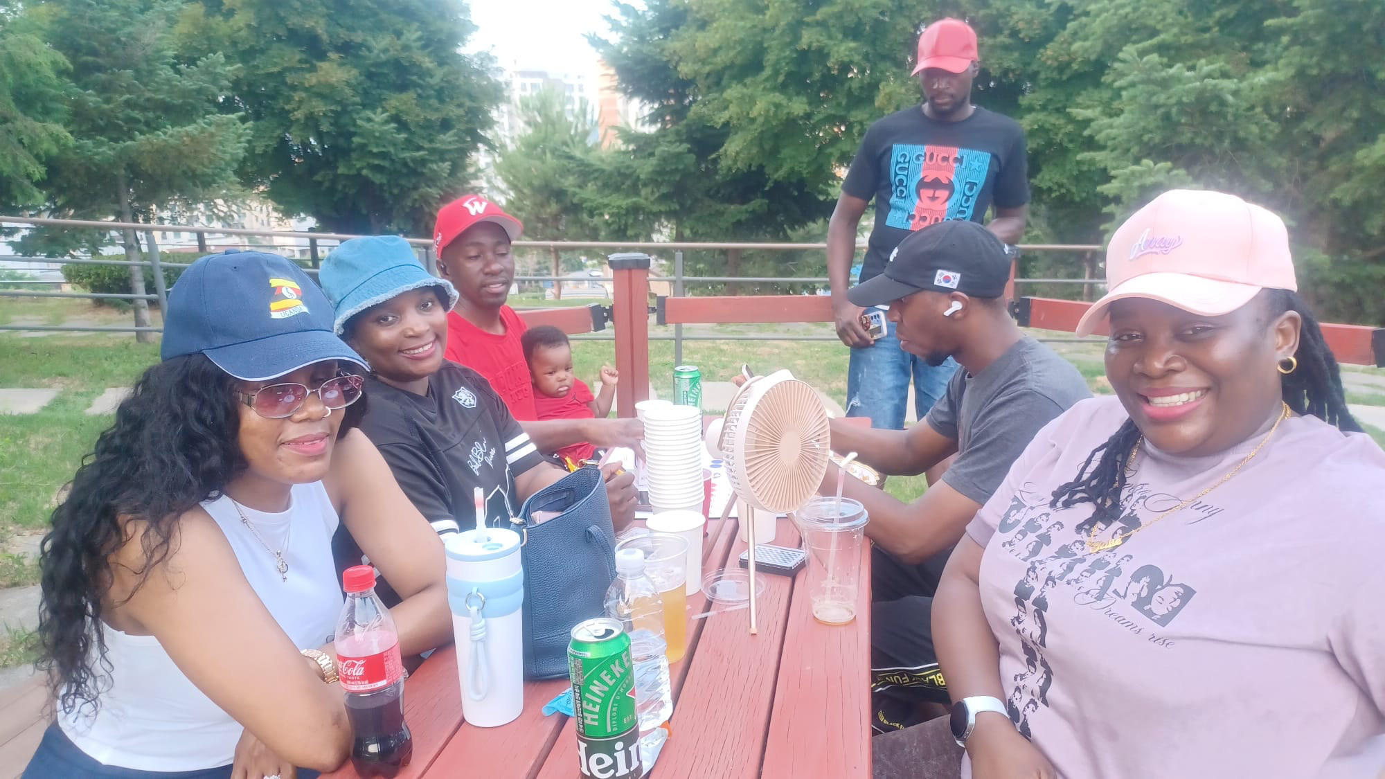 USKA members and families at a picnic table in Songtan
