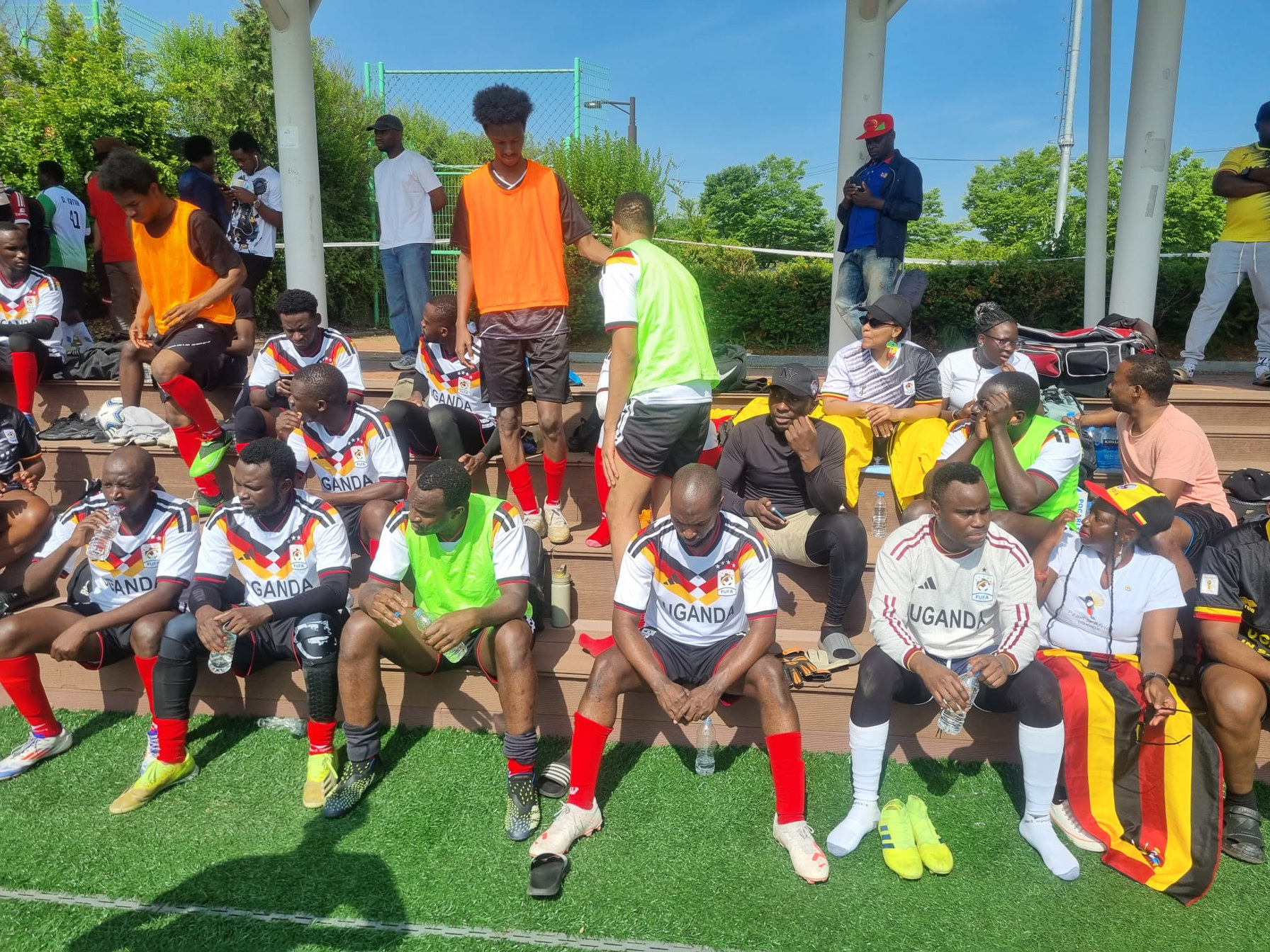 Team Uganda bench and supporters on the sidelines at KAFCON 2026