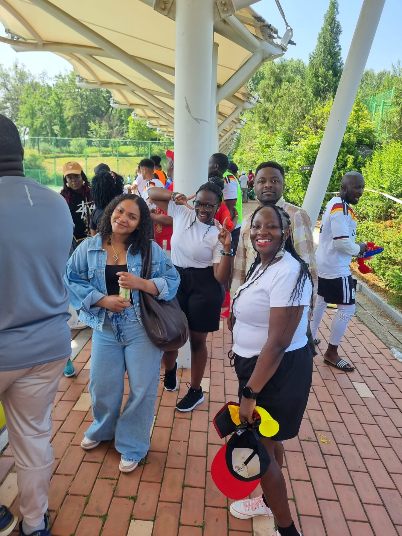 Ugandan community supporters at KAFCON 2026 in Pyeongtaek — cheering Team Uganda