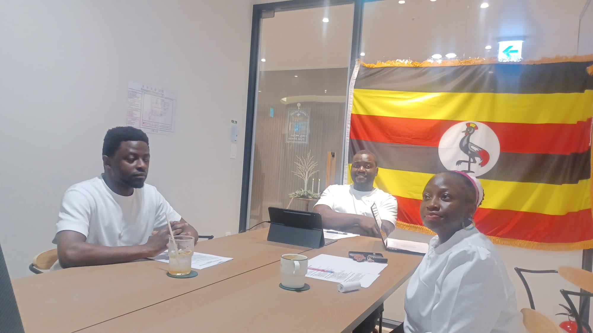 USKA officers at the table during the 11 July 2026 virtual Town Hall, Uganda flag behind them